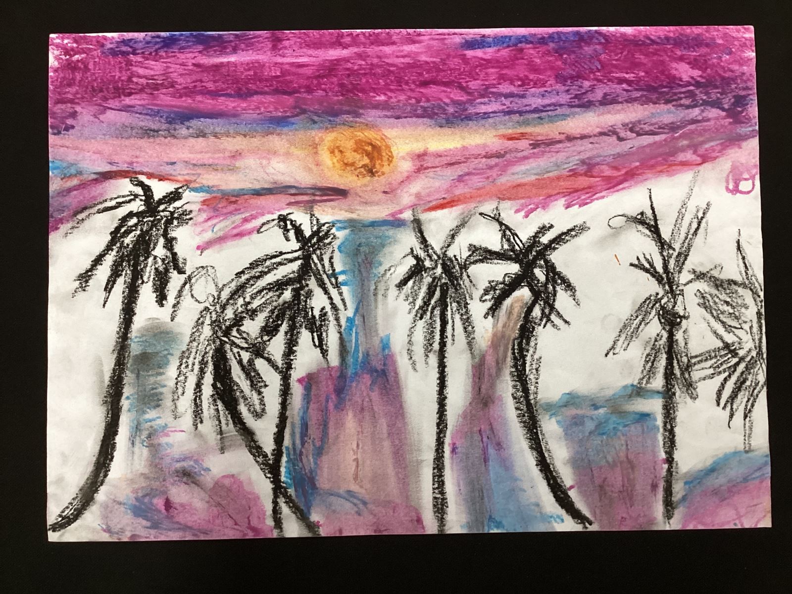 black palm trees under a purple sky