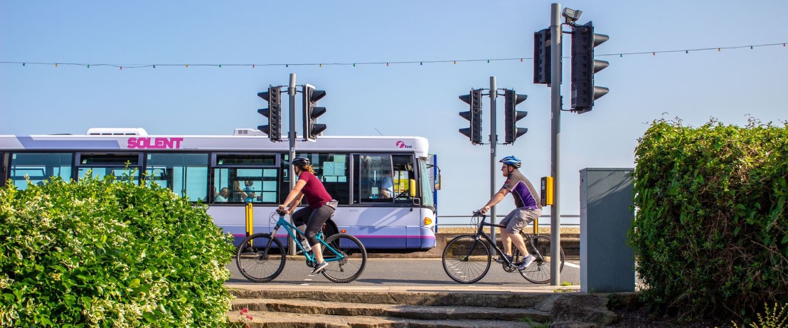 Two people cycling along Southsea seafront