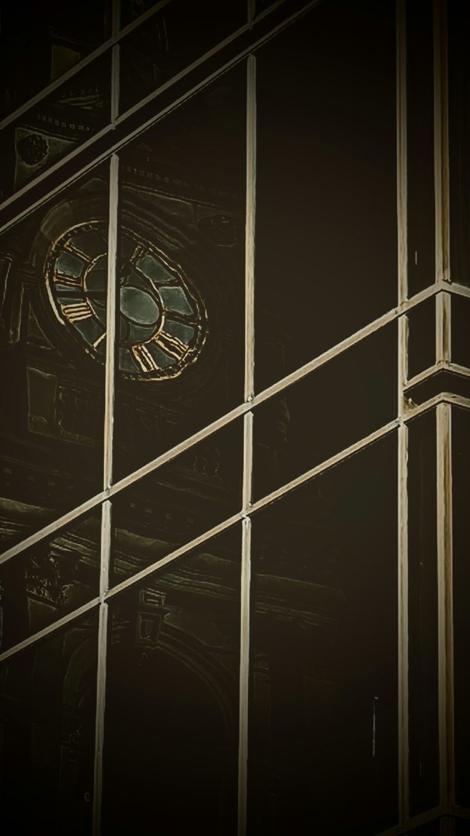 photo of reflection of Portsmouth Guildhall clock in a window