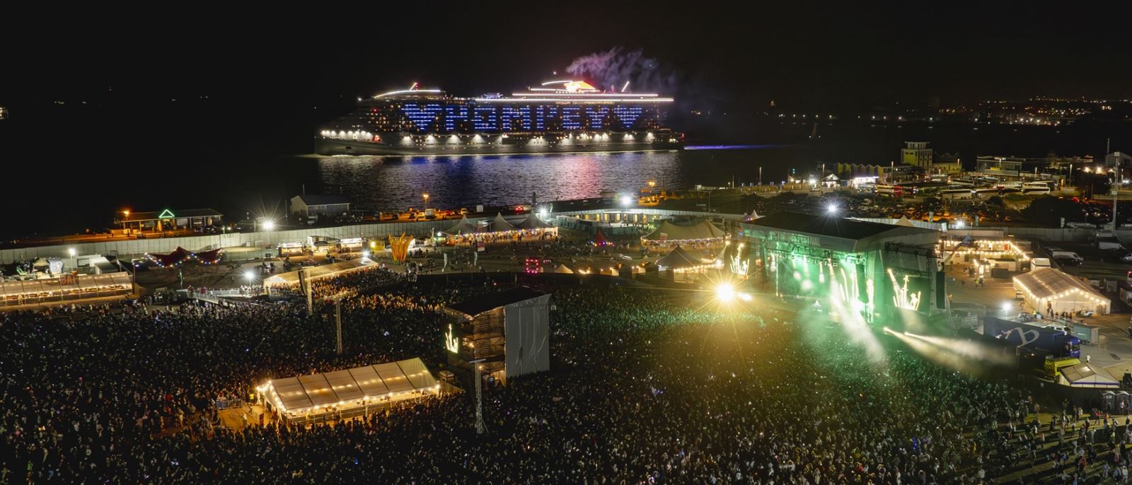 A Virgin Voyages ferry passes the Victorious Festival site