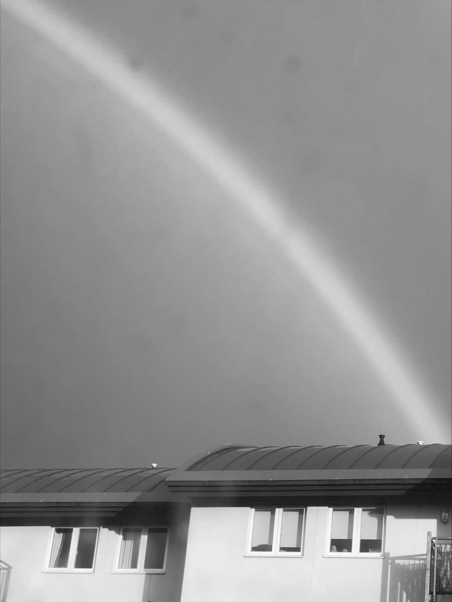 black and white photo of a rainbow