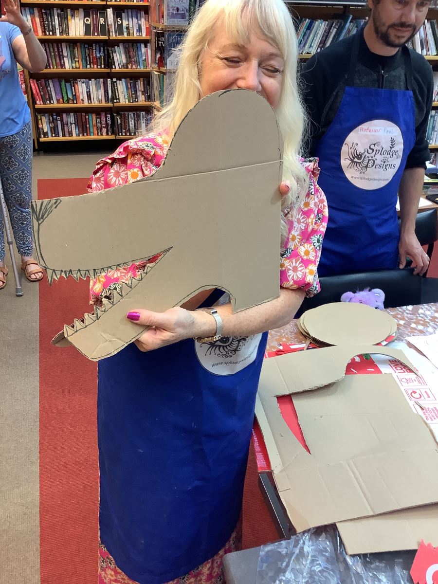 Artist with her cardboard wolf head